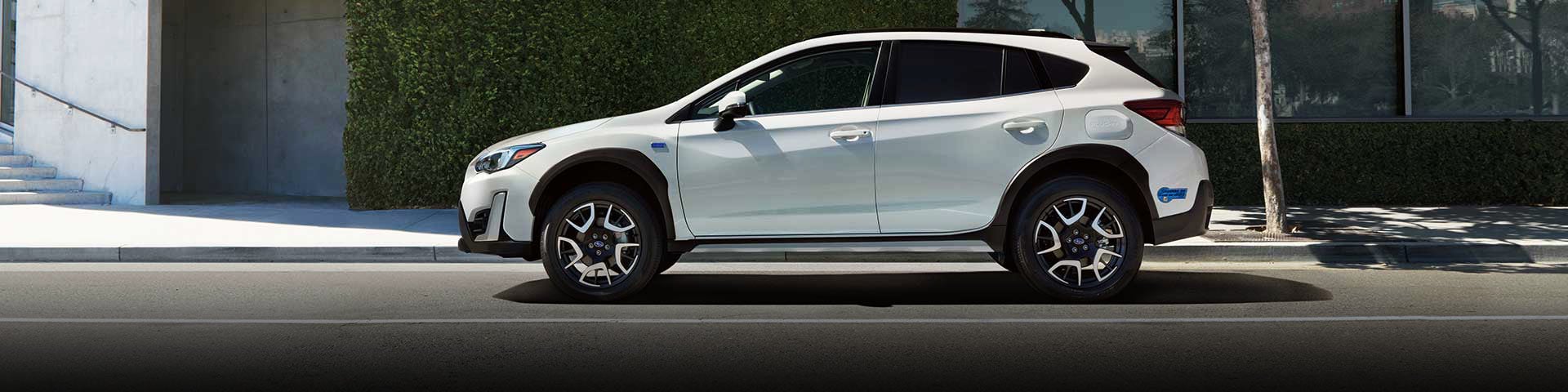 The side profile of a white Subaru Crosstrek Hybrid | Five Star Subaru in Grapevine TX