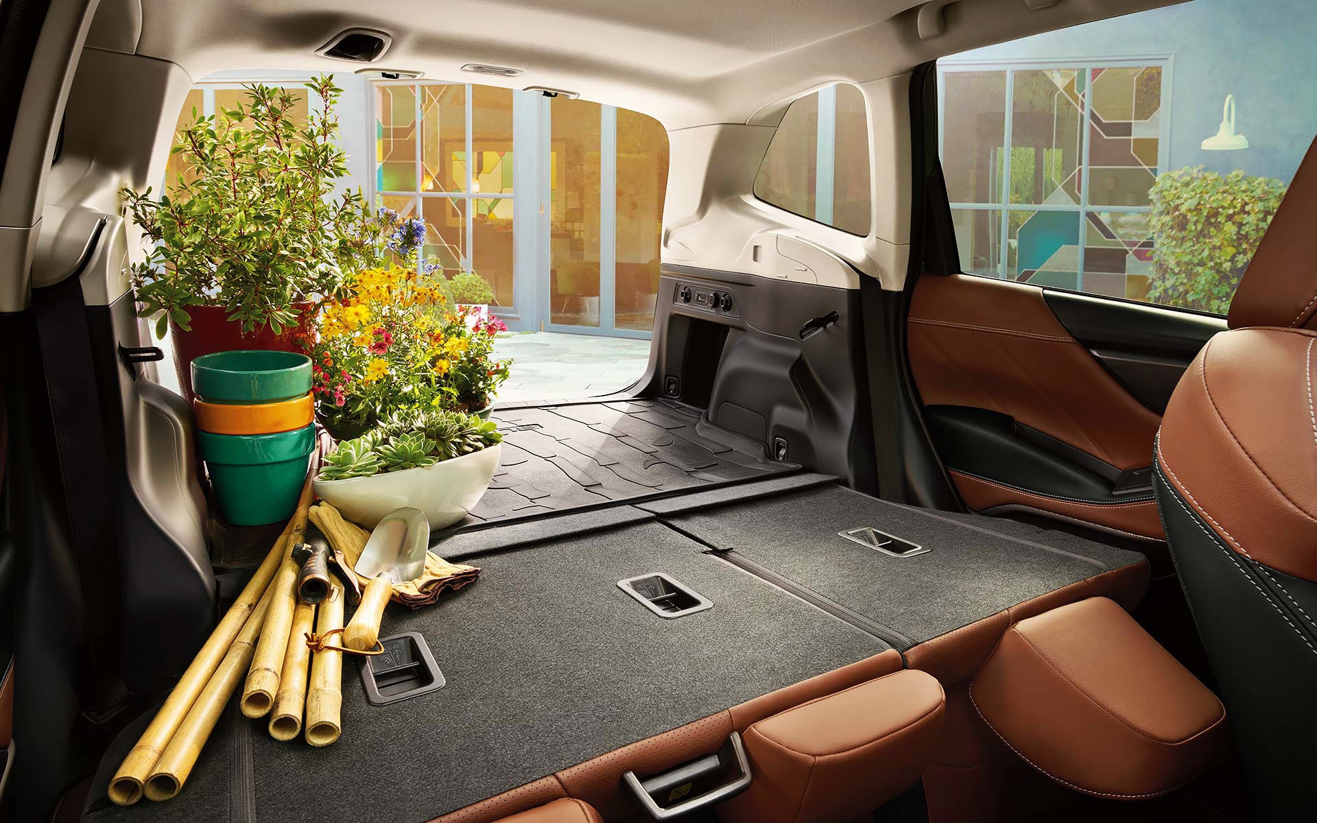 The rear cargo area of the 2022 Forester with the rear seats folded down. | Five Star Subaru in Grapevine TX