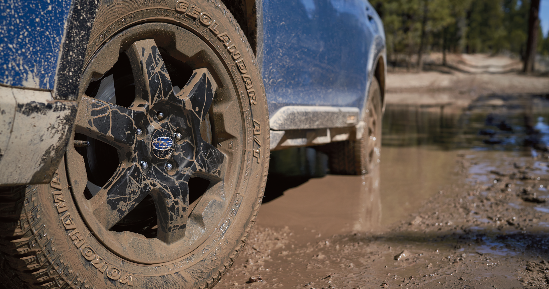 A close-up of the 17-inch off-road wheels and all-terrain Yokohama GEOLANDAR® tires on the 2023 Outback Wilderness. | Five Star Subaru in Grapevine TX